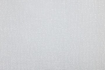 Stylish light grey wallpaper as background, closeup view