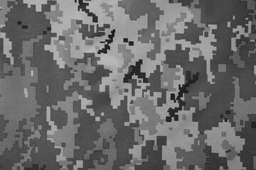 Texture of camouflage fabric as background, top view. Black and white effect