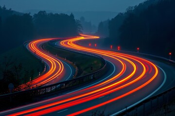Long exposure of traffic lights on a winding road at dusk - obrazy, fototapety, plakaty