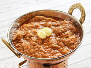 BUTTER CHICKEN Korma MASALA served in karahi isolated on table closeup top view of indian spices food