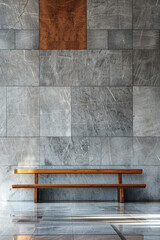 Wooden bench in front of a gray tile wall.