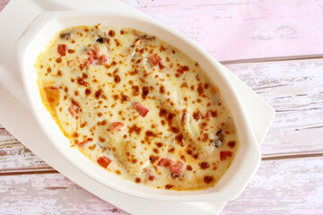 Baked CHICKEN CANNELLONI Served in dish isolated on table closeup top view of italian food