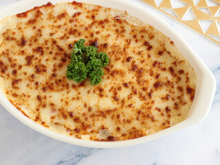 Baked MACARONA BECHAMEL Served in dish isolated on table closeup top view of italian food
