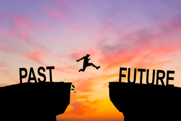 Silhouette of business man jump between past and future text. keep go on to success concept at 2024...