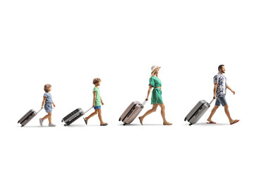 Family with children walking and pulling suitcases
