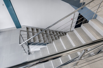emergency and evacuation exit stairs  in up ladder in new empty office building