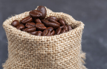 freshly roasted coffee beans in a burlap bag