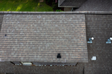 Roof with hail damage and markings from inspection
