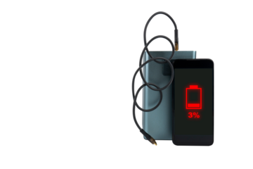 A smartphone next to a large power bank (charging station) with a USB cable on a transparent background. On the smartphone screen there is a red 3% battery charge indicator (low charge)