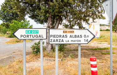 traffic signpost near Piedras Albas pointing the way and distances to several places, province of Caceres, comarca of Alcantara, Extremadura, Spain  - 746126335