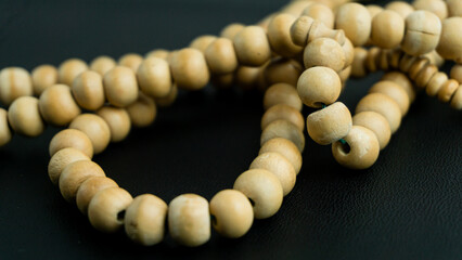 Tasbih made of wood to be used for dhikr dzikir on black background