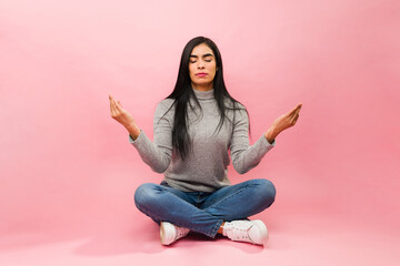 Hispanic beautiful woman meditating and relaxing
