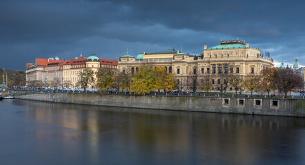 The sunlit Prague embankment - a moment before the rain