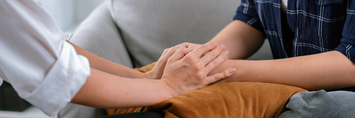 Close up shot of supportive and comforting hands for cheering up depressed person or stressed mind...