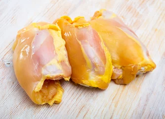 Poster Food background of raw chicken breast fillet at light wooden table © JackF