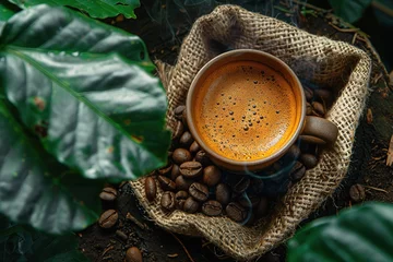 Keuken spatwand met foto Cup of coffee with coffee beans in burlap bag and coffee powder in wooden spoon © Vasiliy