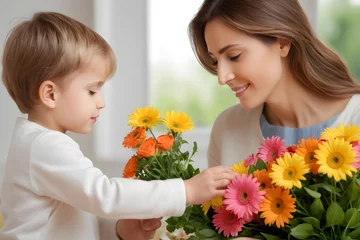 Foto op Canvas A joyful interaction as a woman and toddler handle vibrant flowers together © JohnTheArtist