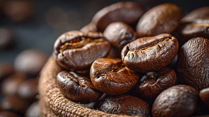 Tuinposter Closeup macro a group roasted brown or black coffee grains background © Vasiliy