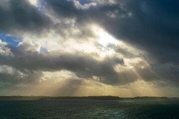 sunbeams in the clouds over the sea