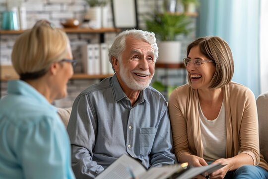 Joyful elder couple in conversation with insurance professional