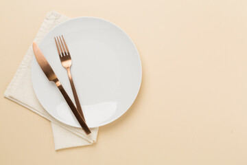 Minimal table setting on color background, top view