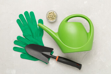 Green gardening tools on concrete background, top view © Liami
