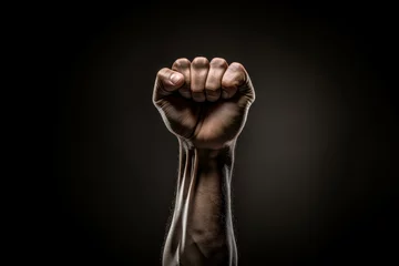 Fotobehang Indistinct Raised fist blurry. Revolution begins with a raised and courageous fist. Generate AI © juliars