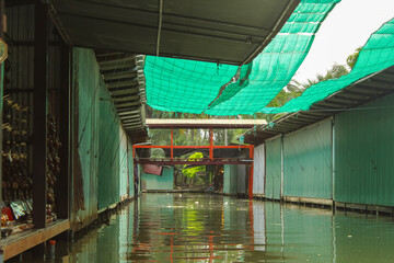 Floating market with fruits, vegetables and different items sold from boats