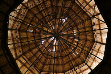 Traditional roof structure of the tribes in the Brazilian Amazon region.Indigeno us wooden structure covered with straw. Indigenous wooden structure covered with straw. Manaus, Amazonas, Brazil.