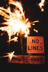 Sparkler with road sign 