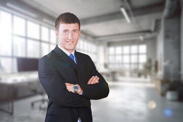 Smiling confident business man posing