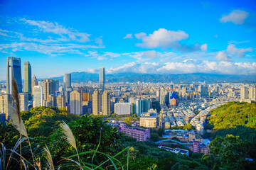 Fototapeta na wymiar Taipei, Taiwan, Republic of China, 01 21 2024: Taipei City (in Republic of China, Taiwan) and mountain at sun set seen from elephant mountain park