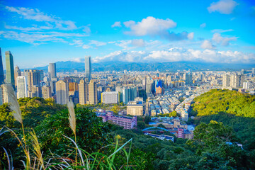 Fototapeta premium Taipei, Taiwan, Republic of China, 01 21 2024: Taipei City (in Republic of China, Taiwan) and mountain at sun set seen from elephant mountain park 
