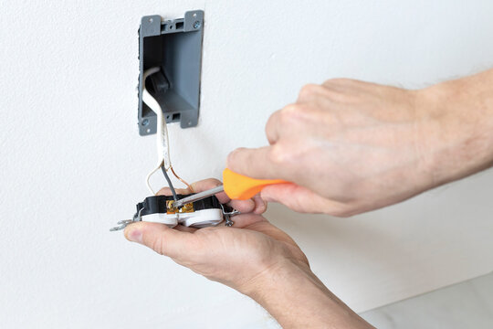 Wiring electrical outlet. Connecting hot wire