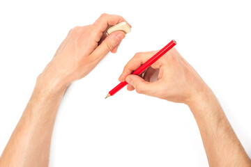 Human hands with pencil and erase rubber writting something