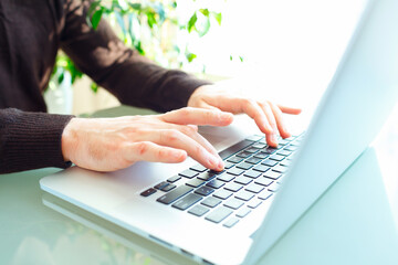 Men office worker typing on the keyboard