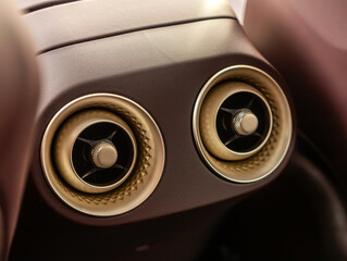  Close up  golden car ventilation system and air conditioning  for rears seats- details