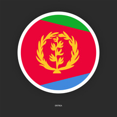 Eritrea circle flag icon with white border on dark grey background. Eritrea circular flag icon isolated on barely dark backrground.