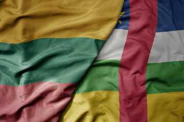 big waving national colorful flag of central african republic and national flag of lithuania .