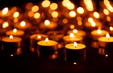Fototapeta na wymiar Burning candles with shallow depth of field