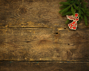 Christmas tree branches with christmas decorations on wooden texture ready for your design