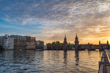 Berlin Germany, sunset city skyline at Oberbaum Bridge and Spree River