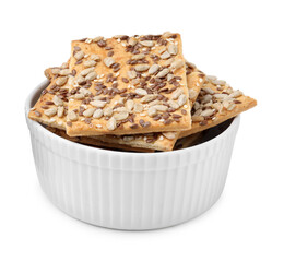 Cereal crackers with flax, sunflower and sesame seeds in bowl isolated on white