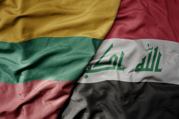 big waving national colorful flag of iraq and national flag of lithuania .
