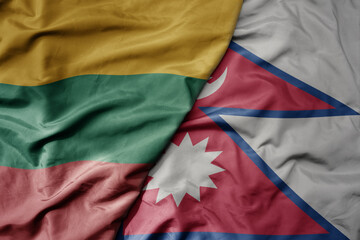 big waving national colorful flag of nepal and national flag of lithuania .