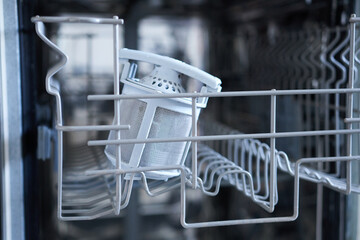 Dishwasher with filter, close-up. Dishwasher repair.