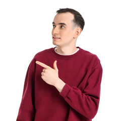 Young man pointing at something on white background