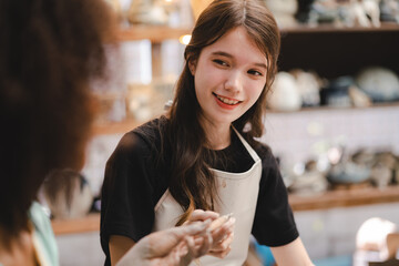 handcraft artist person using art skill of creativity to making ceramic clay craft pottery workshop by hand finger, wet and dirty work with mud for shape bowl traditional in hobby or manufacturing