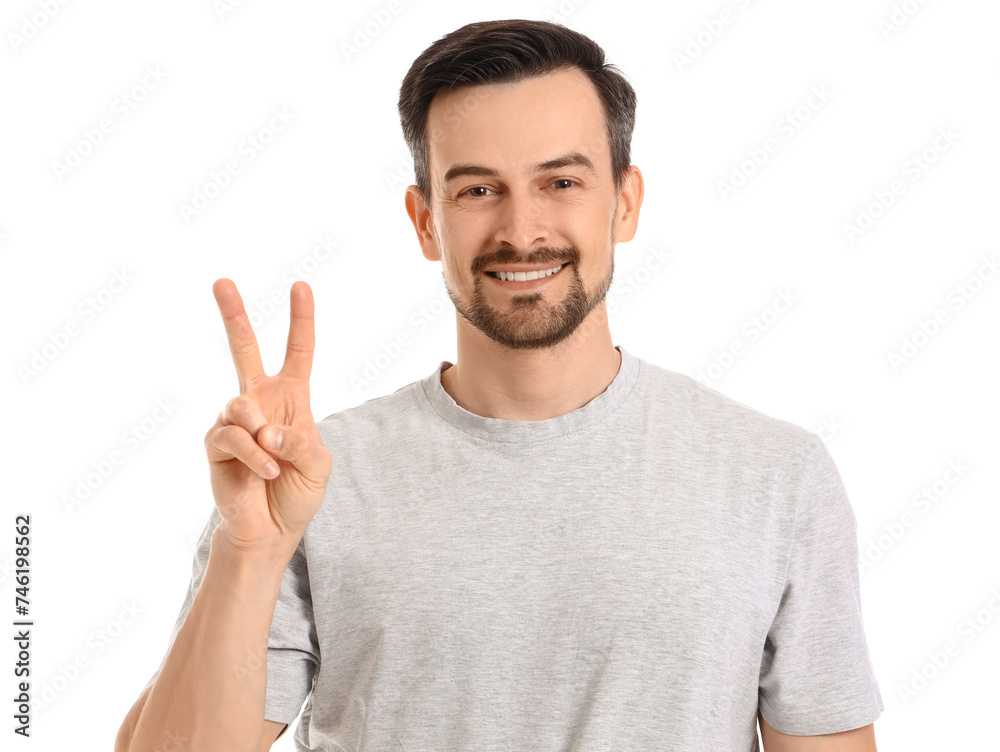 Sticker Handsome man showing victory gesture on white background