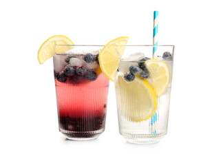 Glasses of fresh blueberry lemonade on white background